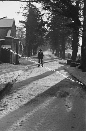 SNOW SCENE ON ROAD OUTSIDE FARM